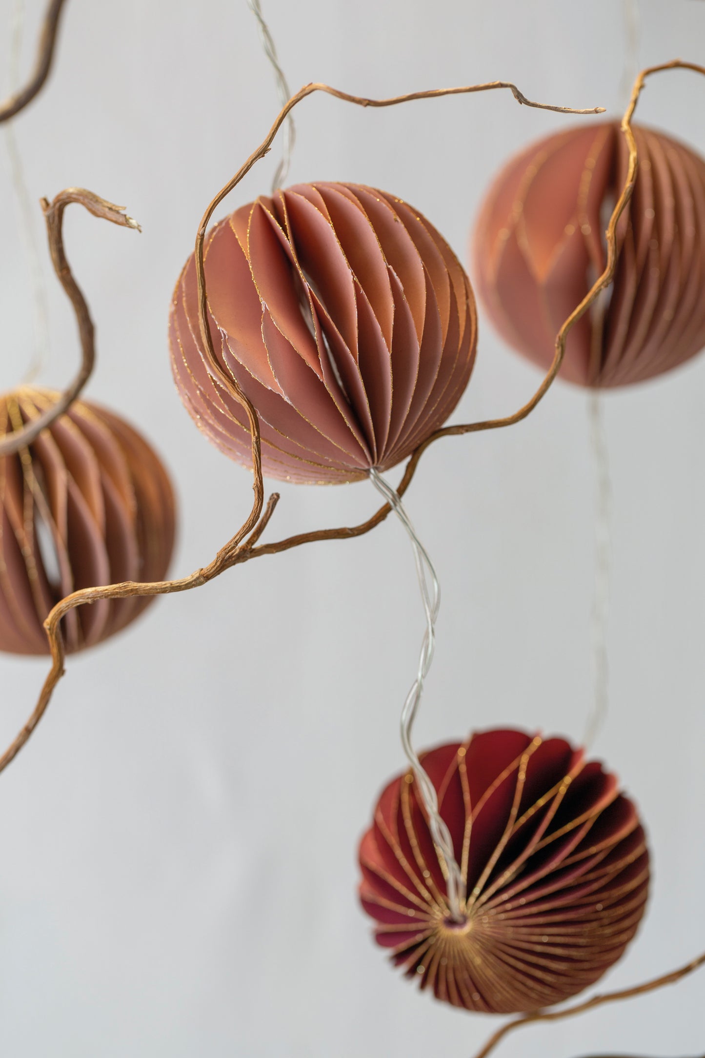 Fairy Light String with Paper bauble decorations in pink and burgundy tones, perfect for contemporary Christmas decor