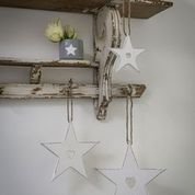 Set of 3 hanging hearts, perfect all year round as well as Christmas.  Each wooden star has a cutout heart detail and rustic distressed white finish. Perfect home accessory for shelf decor or wall decoration