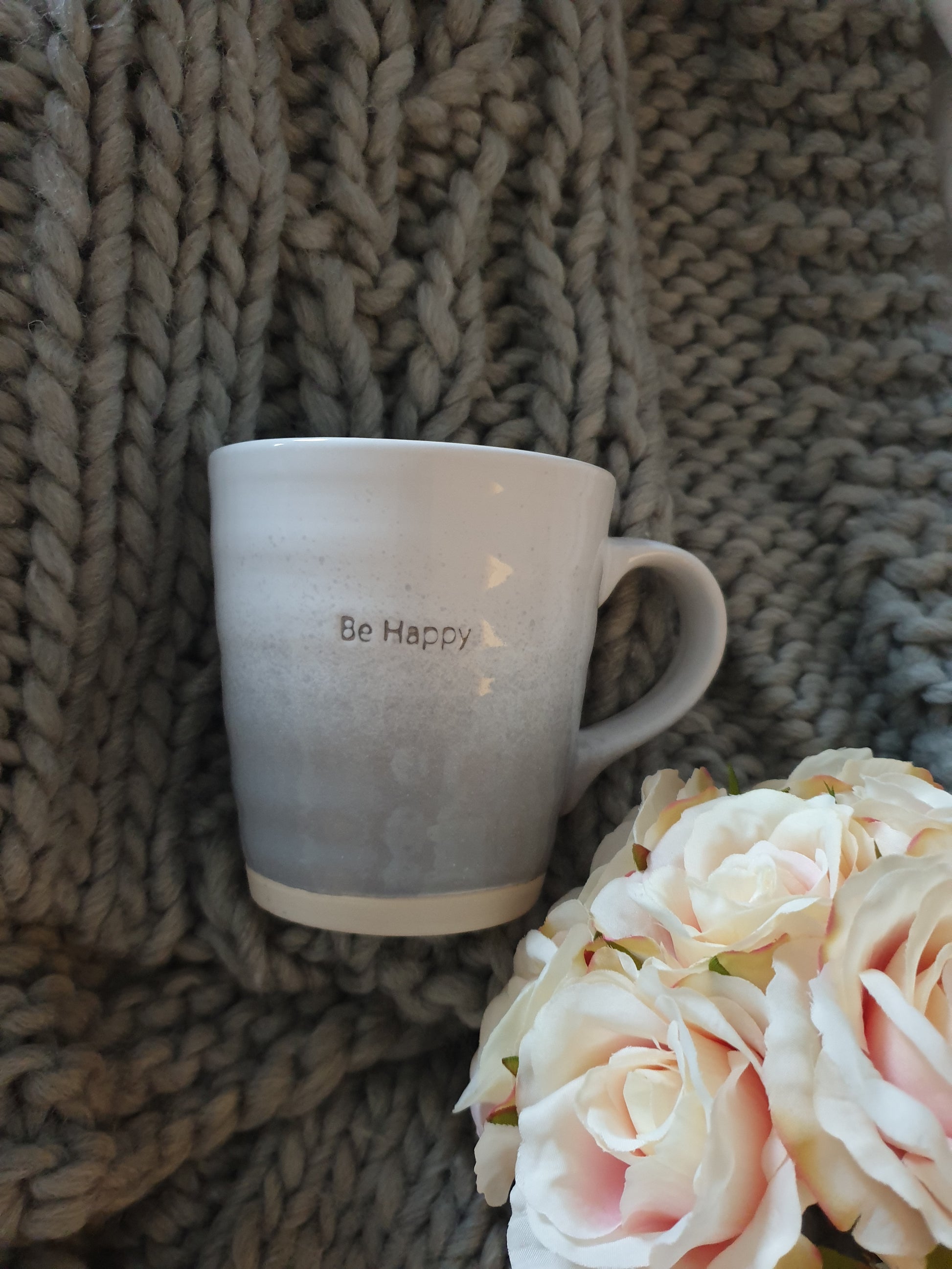 Throw blanket with Be Happy mug to show detail