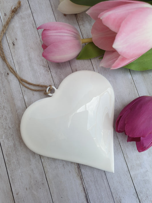 Simple and elegant hanging hearts to fit with modern country, farmhouse and contemporary home decor styles perfectly. The perfect blend between modern and traditional country home styles. Pretty home accessory. Great wall decor, wedding favours, or chair back decorations.