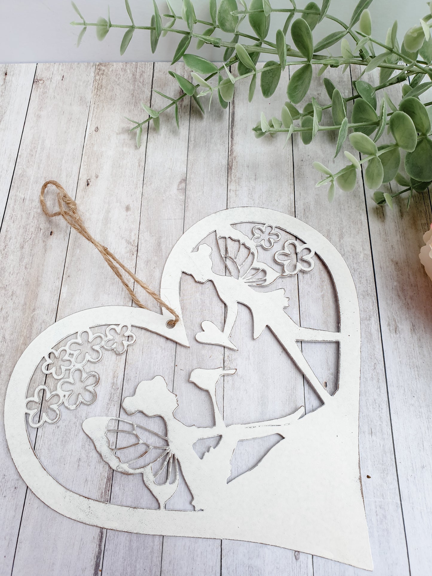 Fairy heart hanger. Metal hanging heart with fairy scene in centre. Beautiful garden decoration for fairy gardens. add magic to your garden wwithour hanging fairy scene heart. pretty whie hanging decoration for the garden. Perfect gift for grandchildren, nieces, nephews, sons and daughters - creating a magical garden for all the family to enjoy.