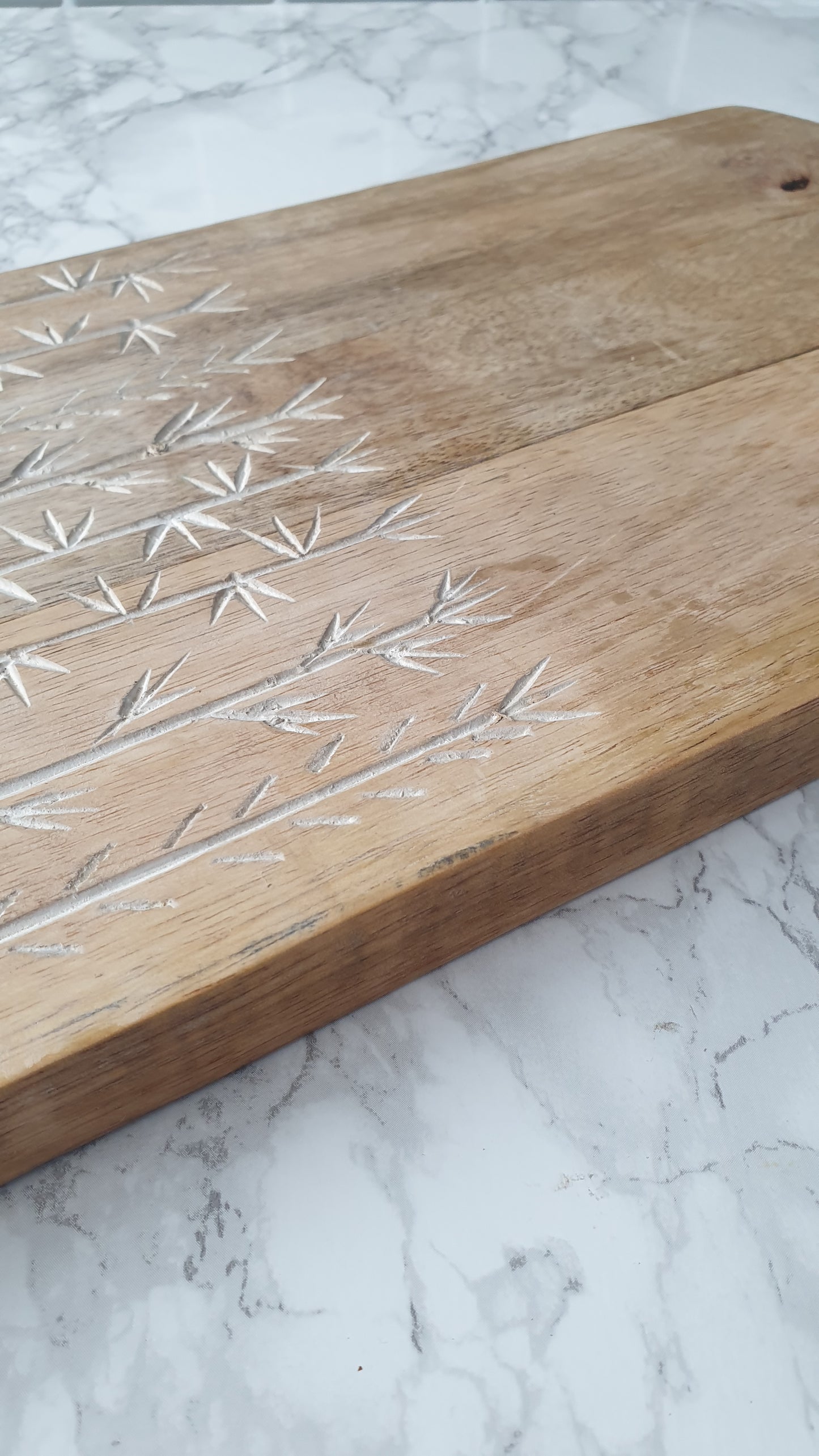 Leaf etched mango wood chopping board