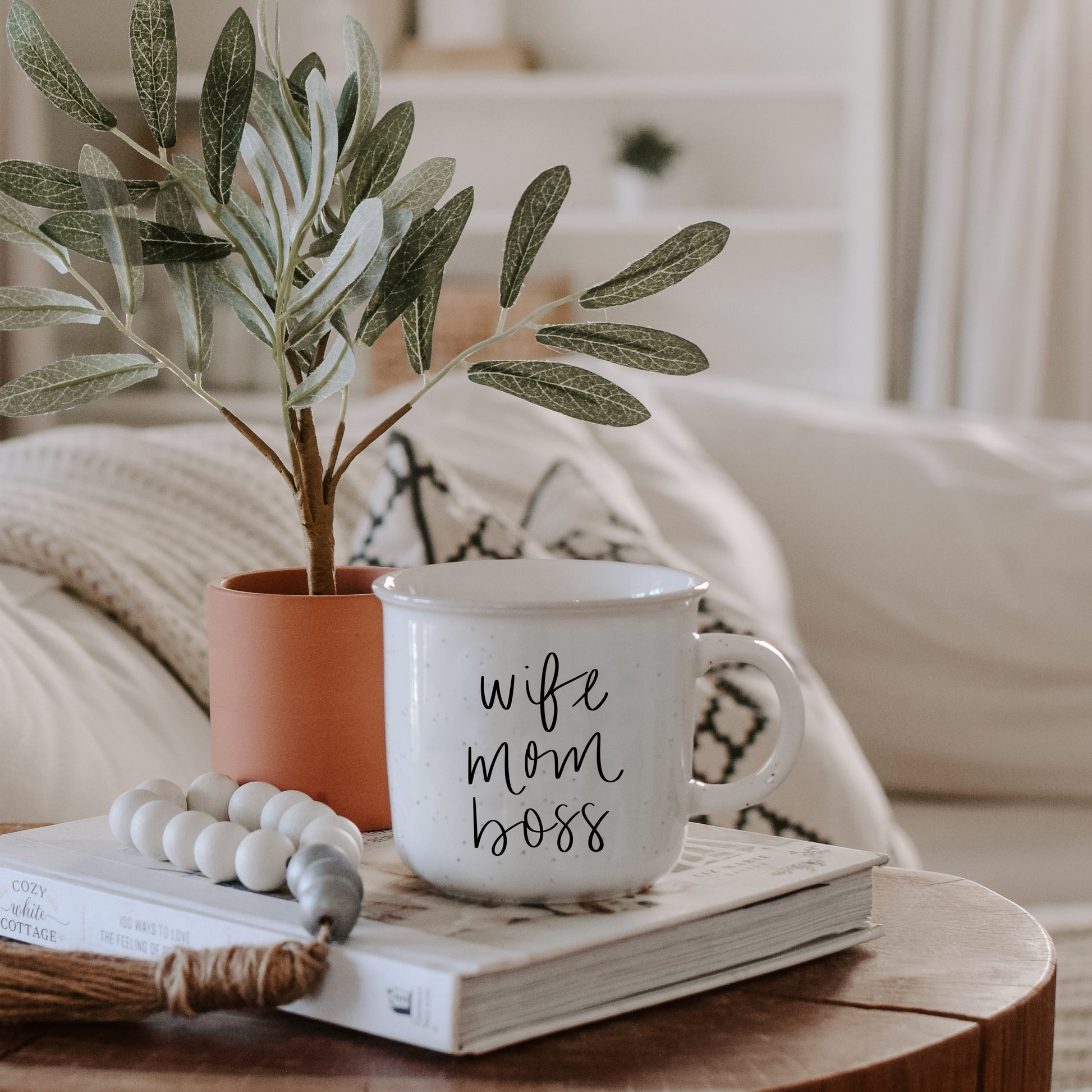 wife mom boss ceramic mug styled in pretty neutral home decor living room