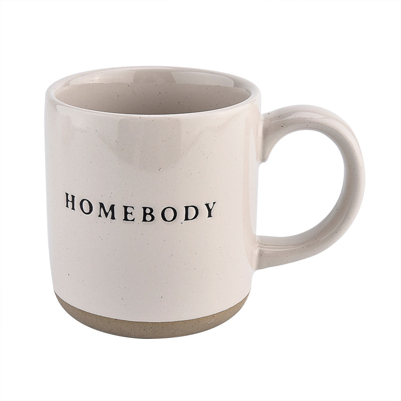 Pour morning coffee into stoneware homebody mug. Perfect gift for home decor and interiors lovers. Embossed homebody lettering on pretty home mug. Gift for tea drinker, hot choclate lover or coffee addict alike. Homebody mug is a partglazed stoneware mug. Makes an ideal mug gift for home lovers