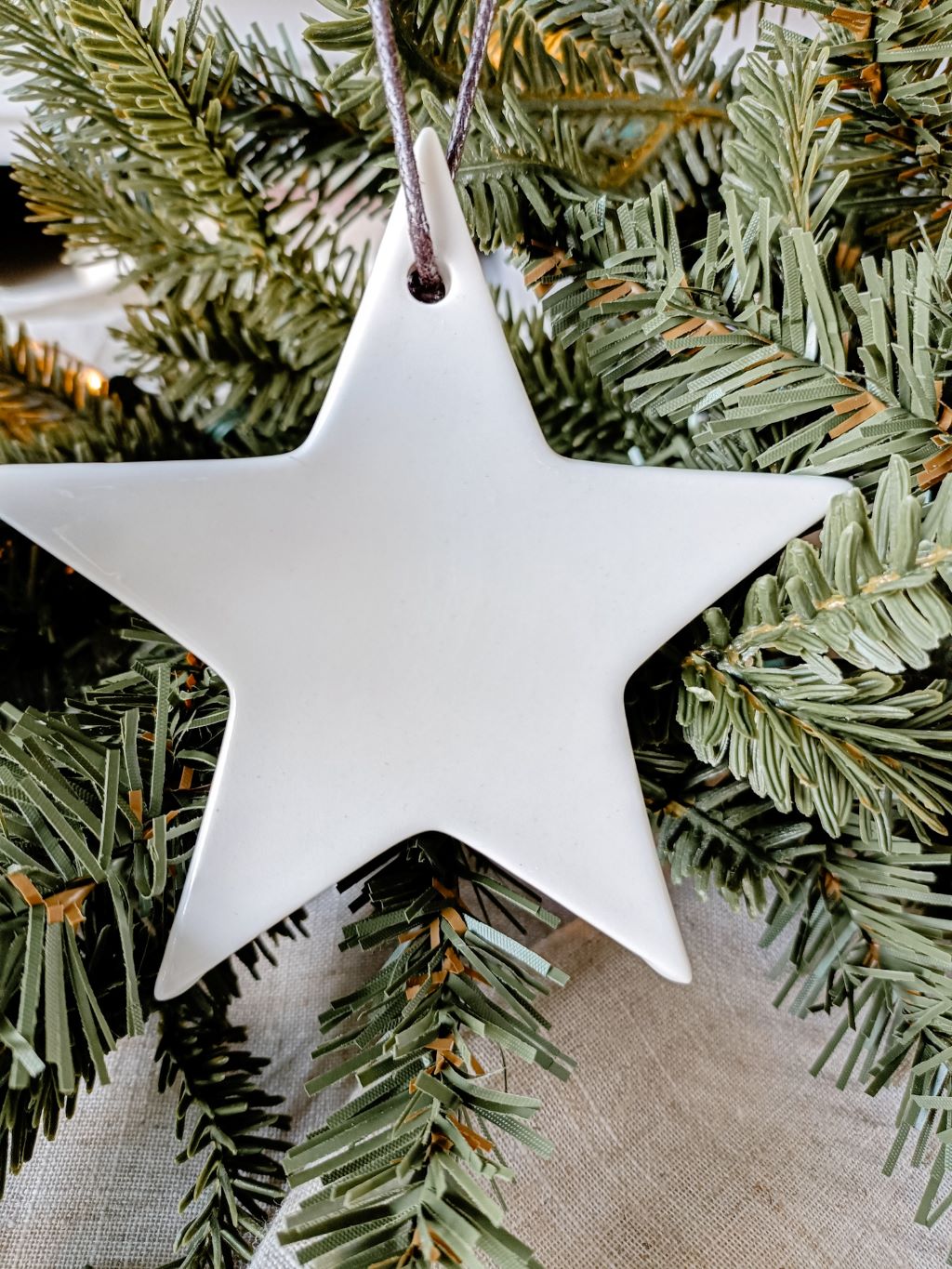 Detail view of our white ceramic hanging star  decoration