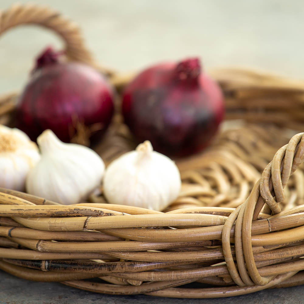 Pretty, practical round kubu rattan tray to create beautiful displays around your home. Pretty bedroom, kitchen, bathroom styling. Basket tray with handles a pretty and practical display solution. Kubu basket | Kitchen counter tray | Pretty display basket | Rattan Basket | Rustic home accessory | Modern Country