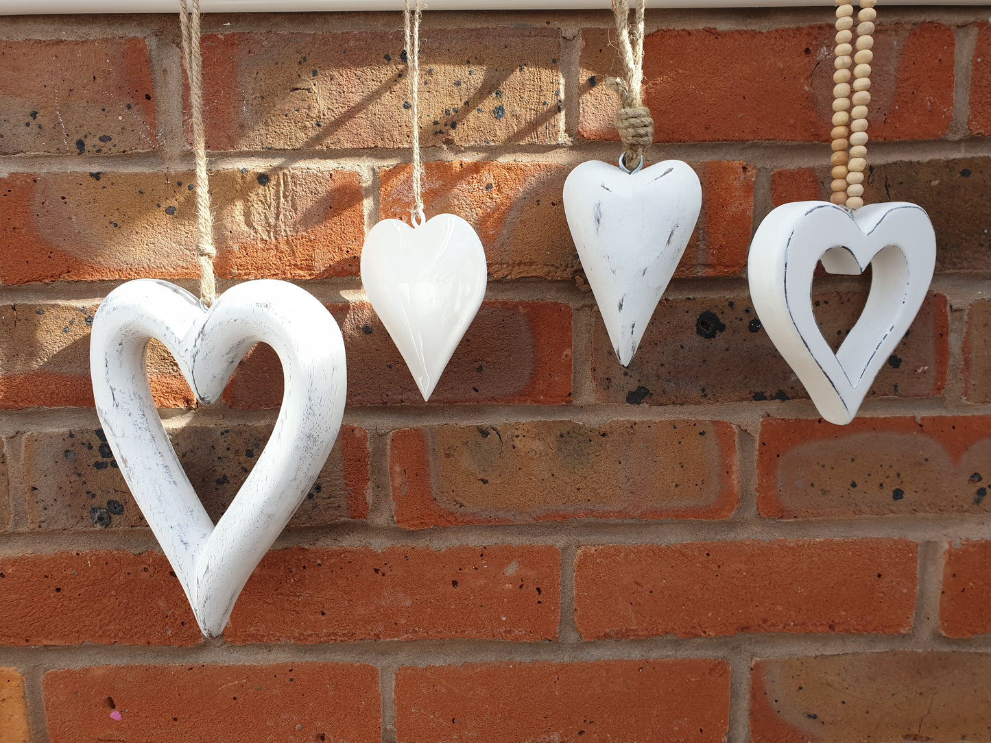 Simple and elegant hanging hearts to fit with modern country, farmhouse and contemporary home decor styles perfectly. The perfect blend between modern and traditional country home styles. Pretty home accessory. Great wall decor, wedding favours, or chair back decorations.