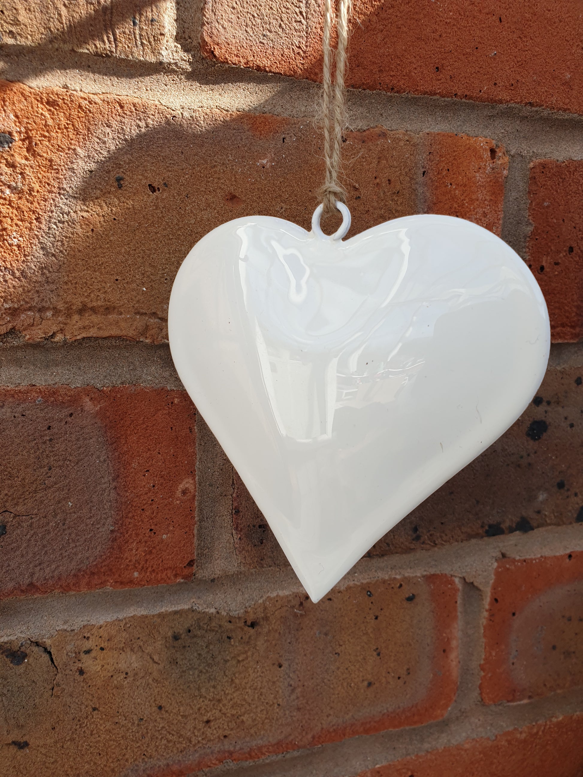 Simple and elegant hanging hearts to fit with modern country, farmhouse and contemporary home decor styles perfectly. The perfect blend between modern and traditional country home styles. Pretty home accessory. Great wall decor, wedding favours, or chair back decorations.