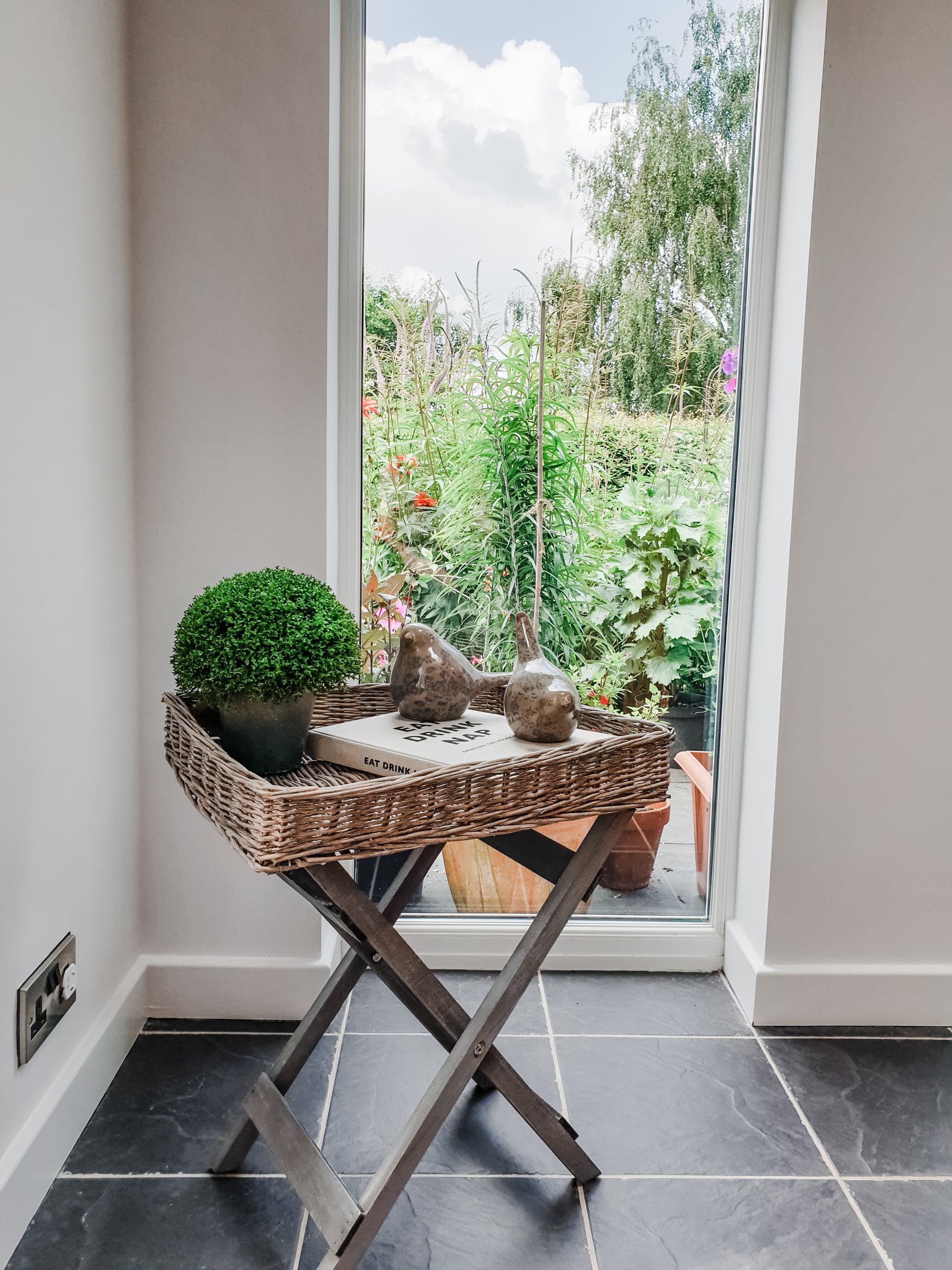 Folding wicker tray table. Perfect home accessory for country & cottage interiors. Butler style tray with folding legs mean this portable tray table is perfect for small sapces, adding to a sofa end or using as a temporary bedside table. Handmade rustic finish in grey.