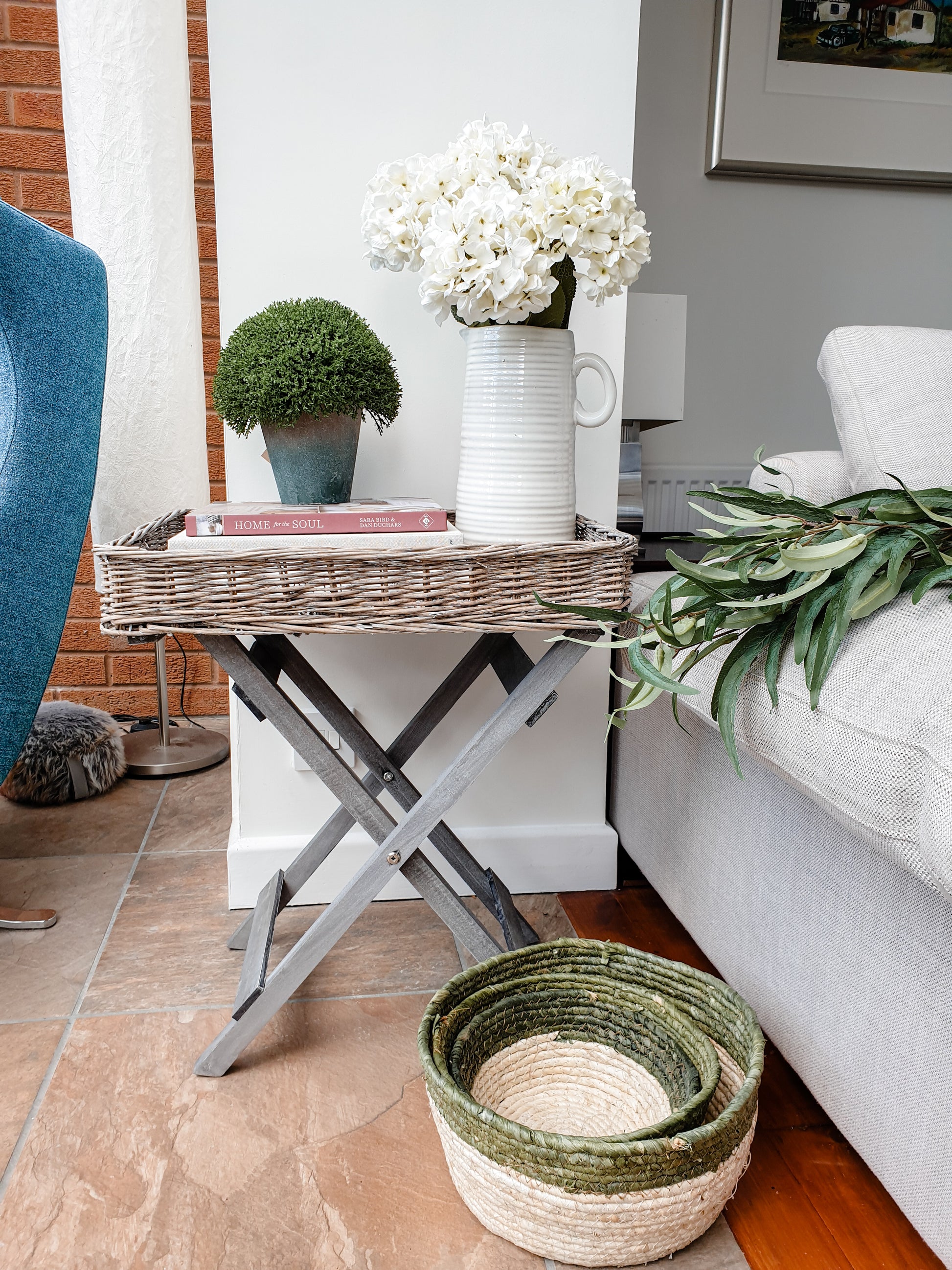 Folding wicker tray table. Perfect home accessory for country & cottage interiors. Butler style tray with folding legs mean this portable tray table is perfect for small sapces, adding to a sofa end or using as a temporary bedside table. Handmade rustic finish in grey.