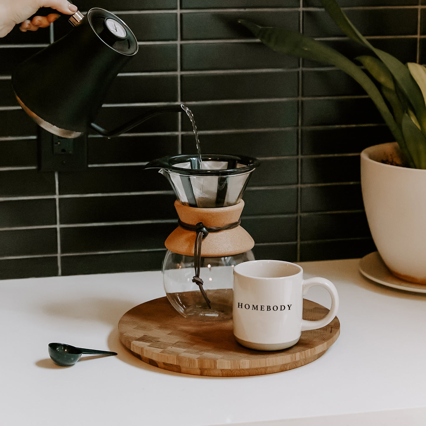 Pour morning coffee into stoneware homebody mug. Perfect gift for home decor and interiors lovers. Embossed homebody lettering on pretty home mug. Gift for tea drinker, hot choclate lover or coffee addict alike. Homebody mug is a partglazed stoneware mug. Makes an ideal mug gift for home lovers