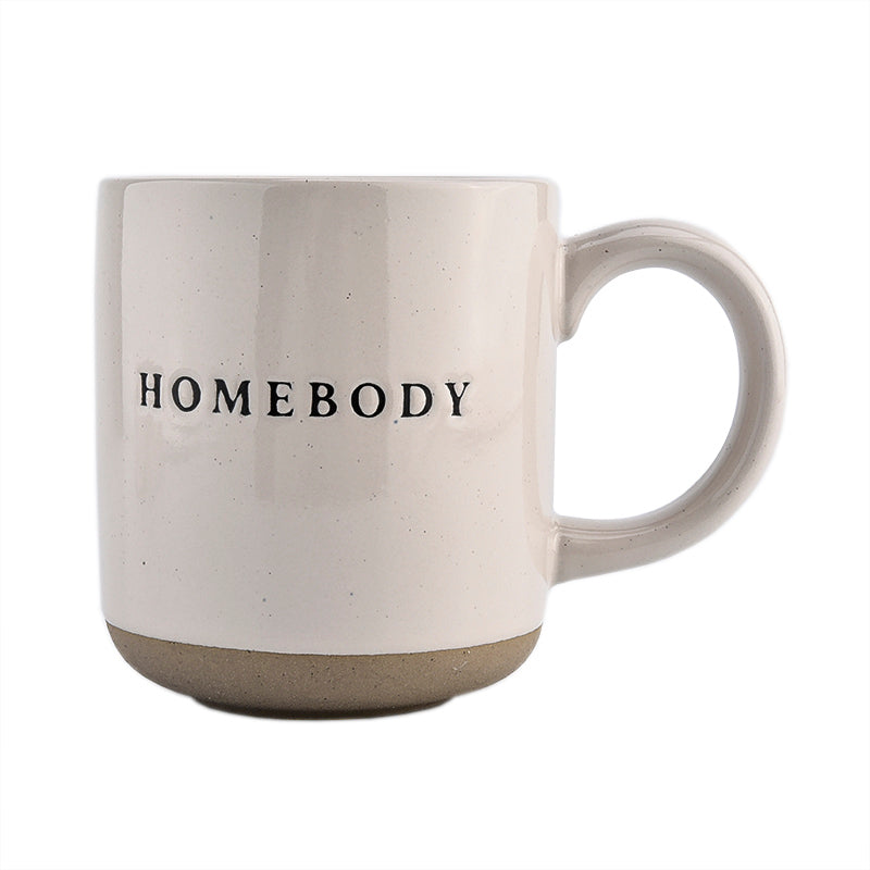 Pour morning coffee into stoneware homebody mug. Perfect gift for home decor and interiors lovers. Embossed homebody lettering on pretty home mug. Gift for tea drinker, hot choclate lover or coffee addict alike. Homebody mug is a partglazed stoneware mug. Makes an ideal mug gift for home lovers