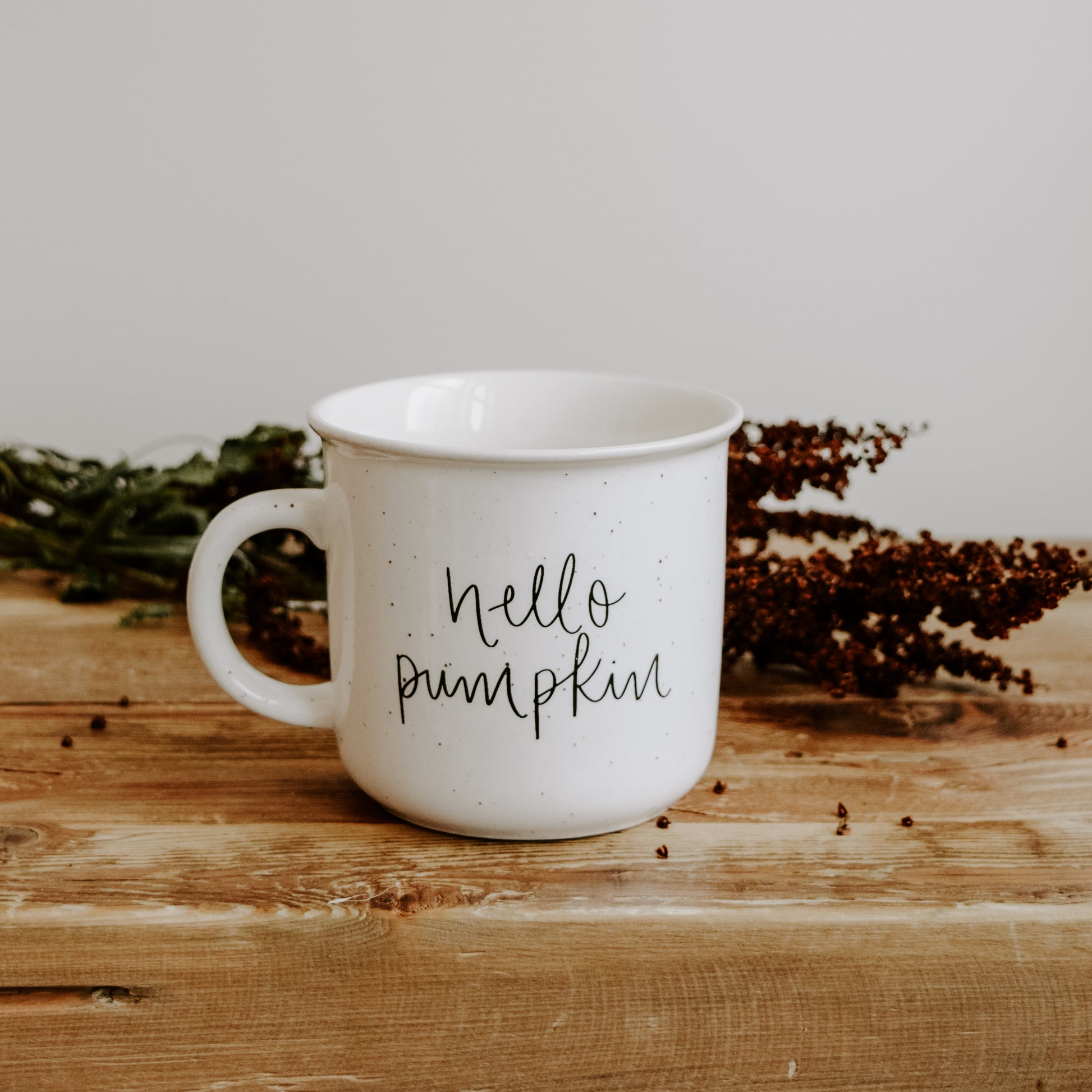 rustic setting for our hello pumpkin ceramic mug - perfect autumn vibe