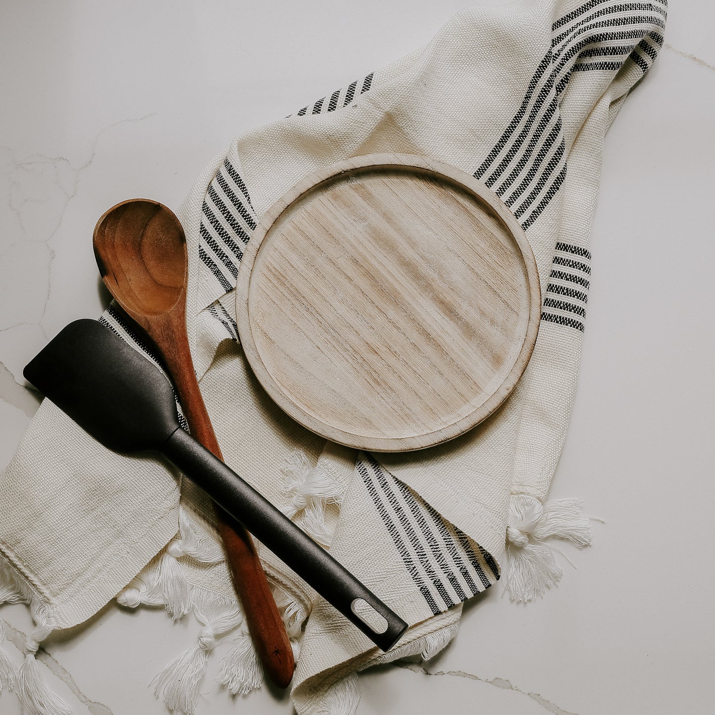 Rustic wood tray on cloth with utensils. Perfect for kitchen styling 