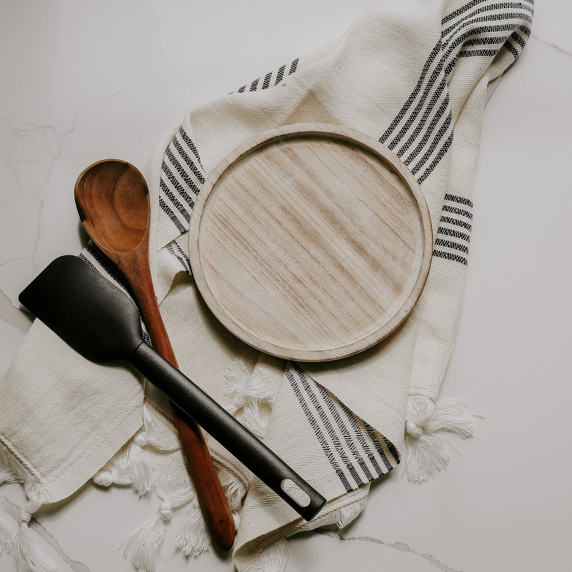 Rustic wood tray on cloth with utensils. Perfect for kitchen styling 