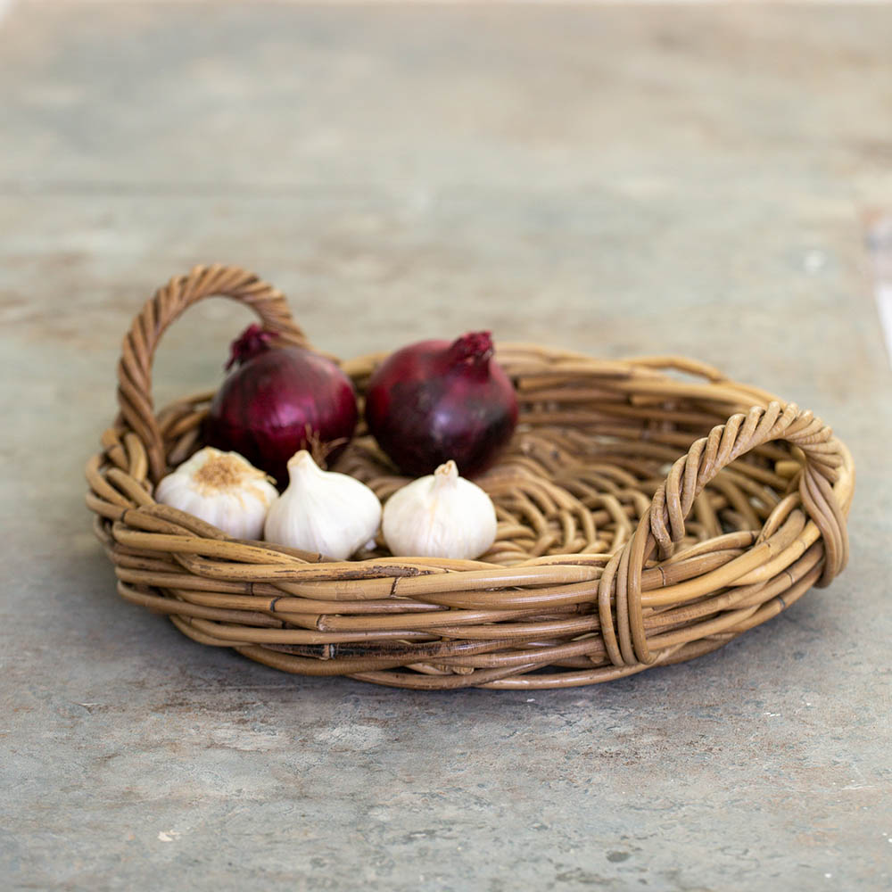 Pretty, practical round kubu rattan tray to create beautiful displays around your home. Pretty bedroom, kitchen, bathroom styling. Basket tray with handles a pretty and practical display solution. Kubu basket | Kitchen counter tray | Pretty display basket | Rattan Basket | Rustic home accessory | Modern Country