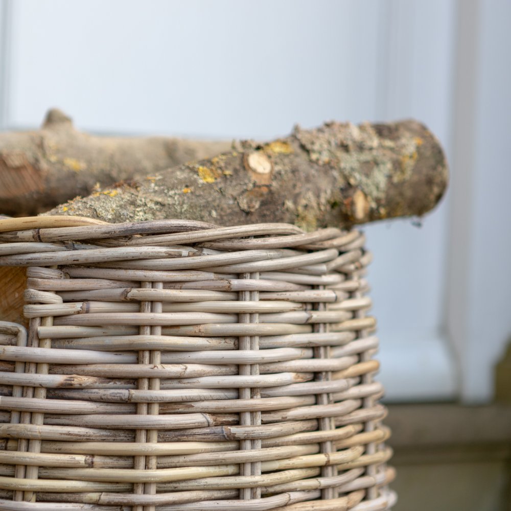 Detailed view of our round rattan blanket / log basket - here shown holding logs
